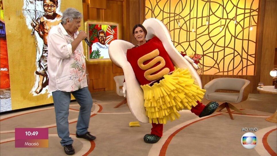 Fátima Bernardes se veste de cachorro-quente para receber Sidney Magal no Encontro (Reprodução/Globo)